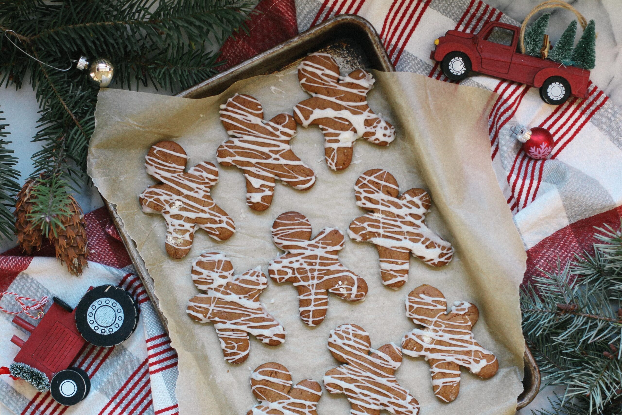 Photo of Einkorn Gingerbread Men on a tray with evergreen branches and Christmas linens