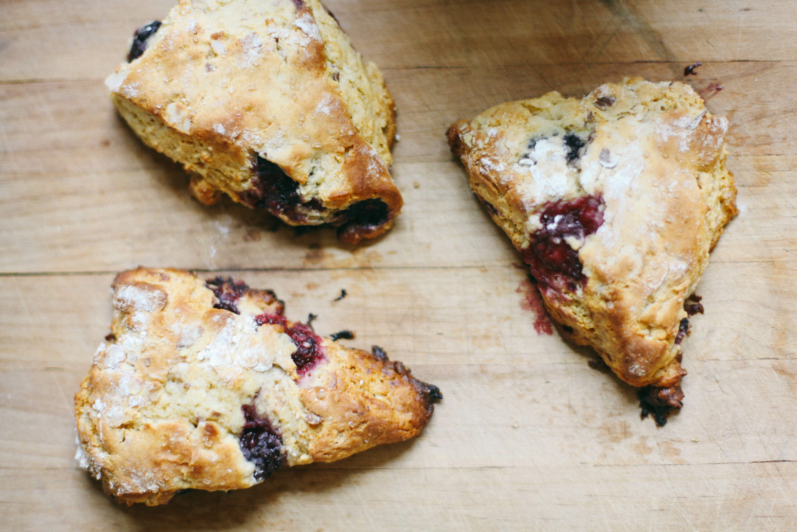 Photo of berry scones on a wooden cutting board