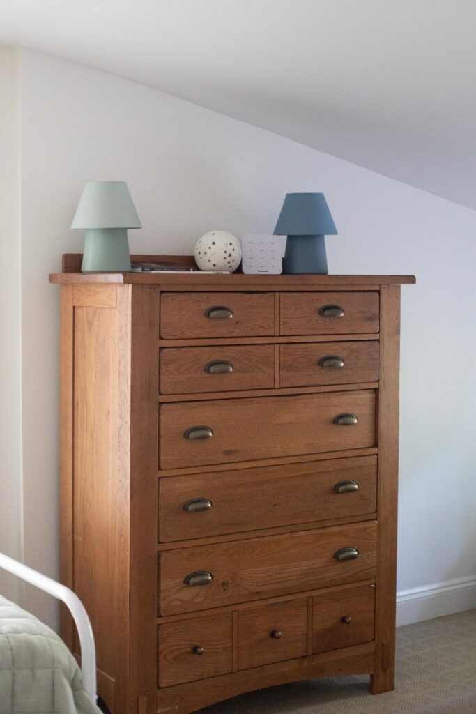 Image of a secondhand oak dresser in an attic kids bedroom