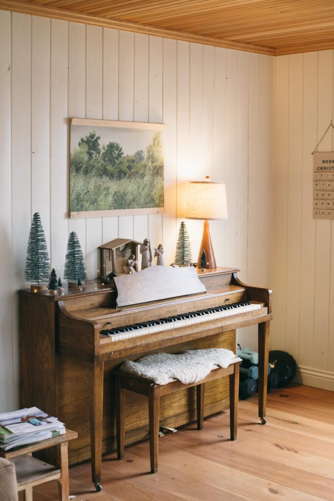 Image of a piano with a Willow Tree nativity set in a cozy, calm Cottage Christmas