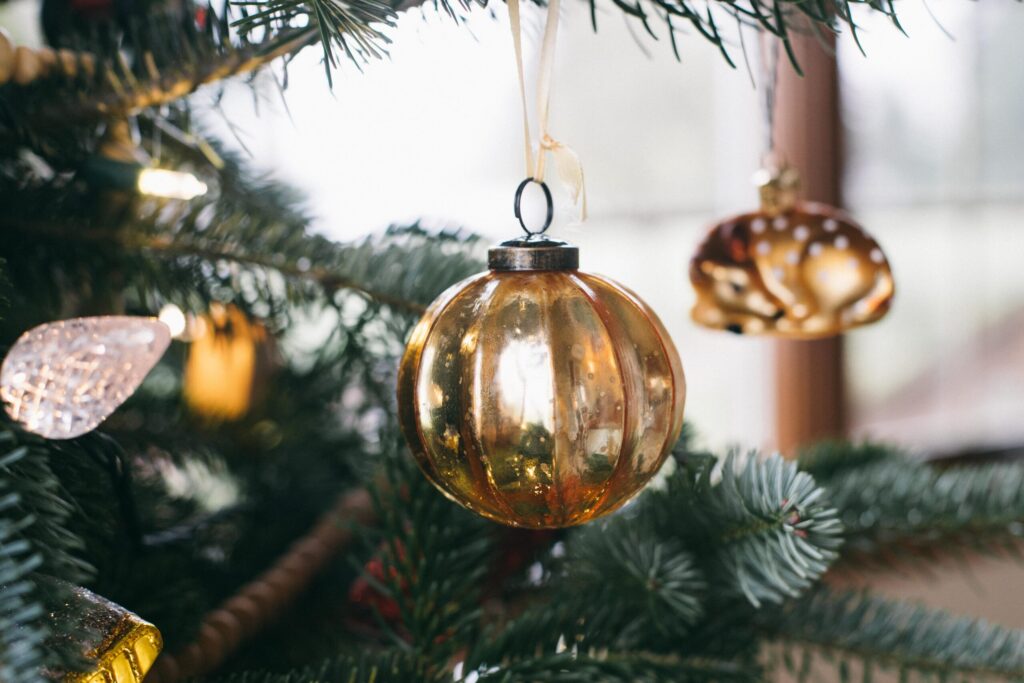 Image of a gold ornament on a Cottage Christmas tree